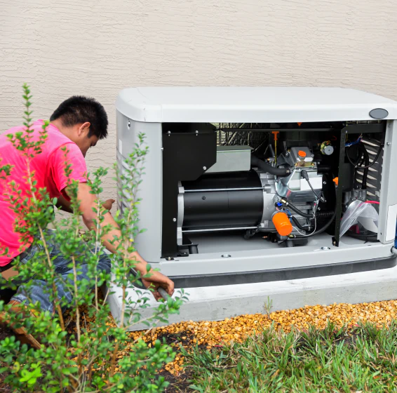 worker doing residential generator installation service